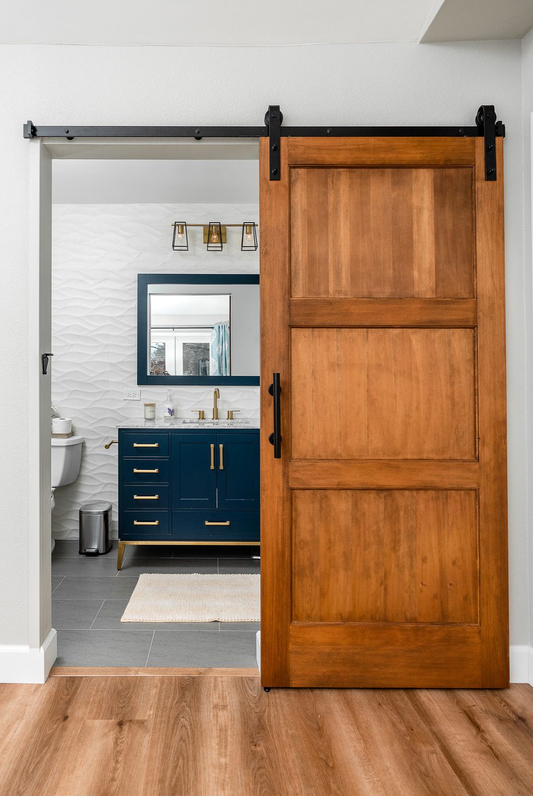 Barn-door entry and plank tile floor
