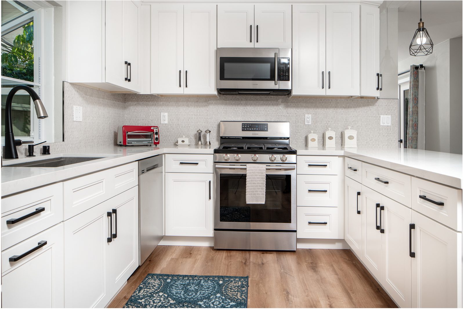 Bright white kitchen with tile backsplash