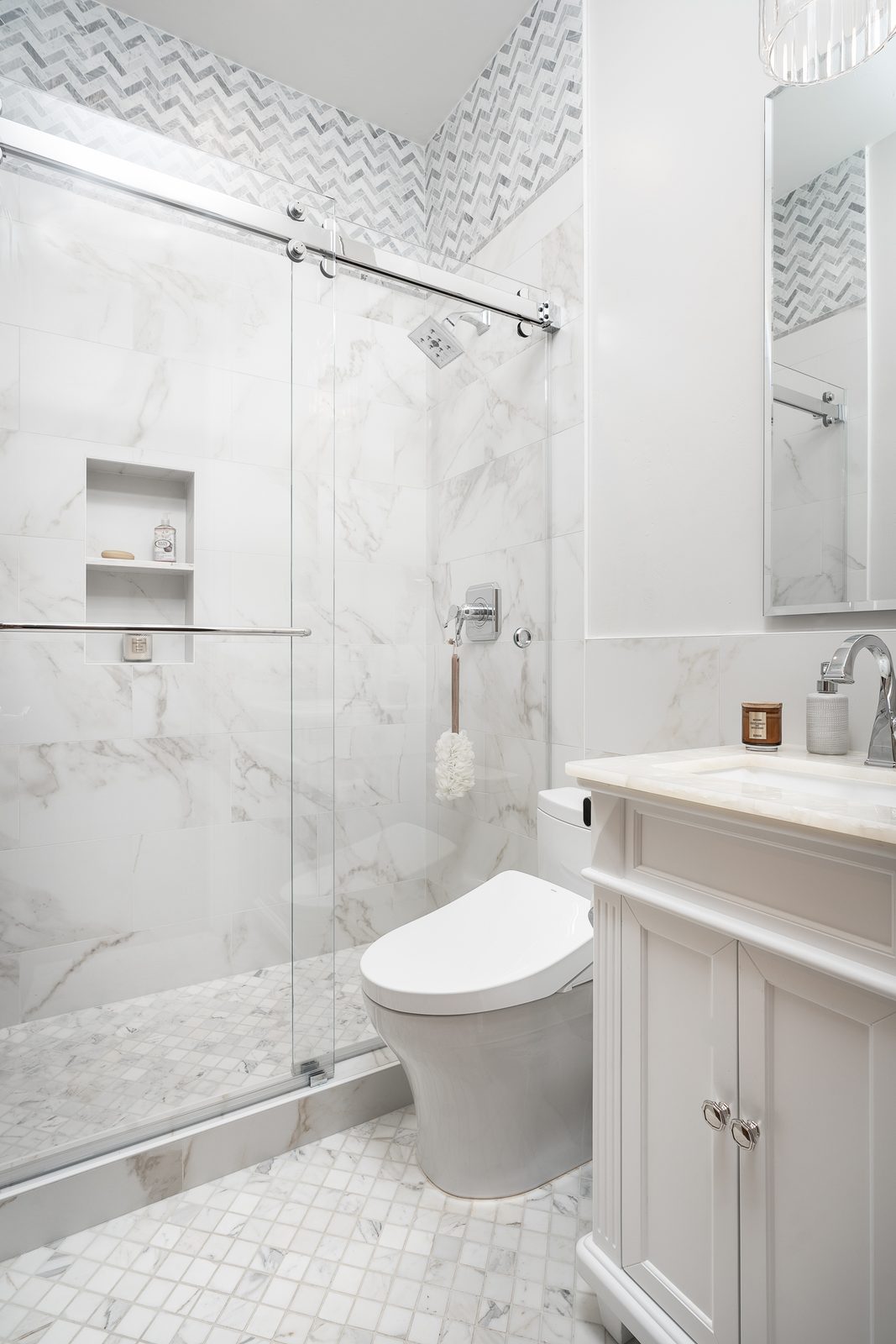 Glass shower and mosaic floor
